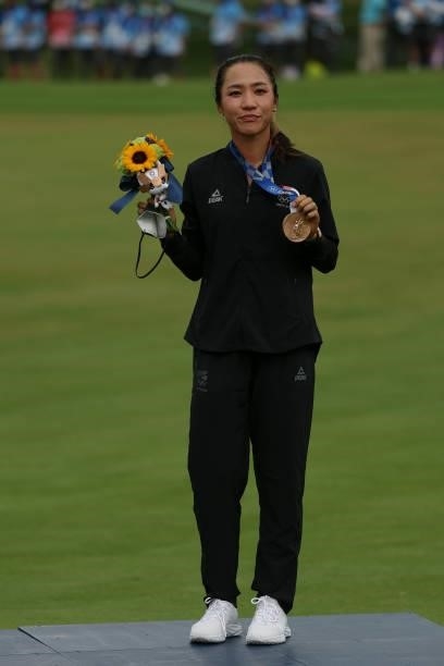 Lydia Ko of Team New Zealand celebrates with the bronze medal during the Victory Ceremony after the final round of the Women's Individual Stroke Play...