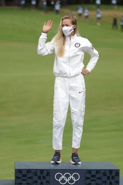 Gold medalist Nelly Korda of Team United States waves from the podium during the victory ceremony after the final round of the Women's Individual...