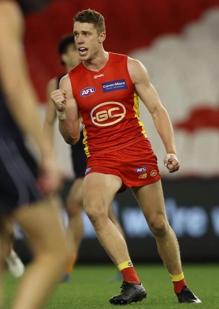 Josh Corbett of the Suns celebrates after scoring a goal during the round 21 AFL match between Carlton Blues and Gold Coast Suns at Marvel Stadium on...