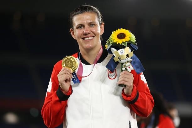 Christine Sinclair of Team Canada poses with her gold medal after her teams victory during the Gold Medal Match Women's Football match between Canada...