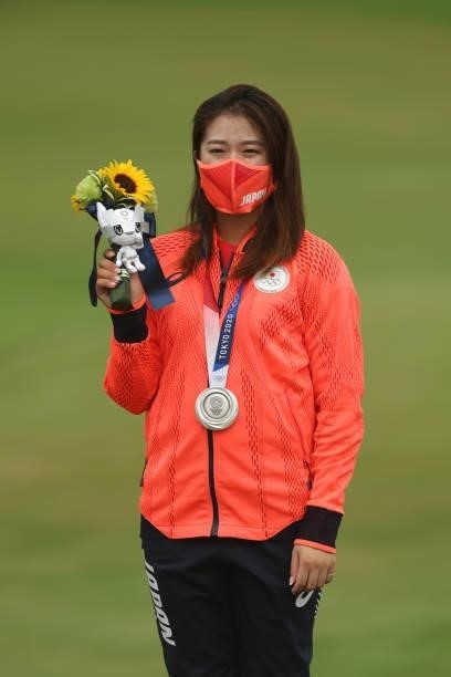 Mone Inami of Team Japan celebrates with the silver medal at the victory ceremony after the final round of the Women's Individual Stroke Play on day...