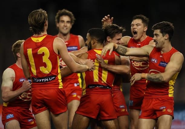 Touk Miller of the Suns celebrates after scoring a goal during the round 21 AFL match between Carlton Blues and Gold Coast Suns at Marvel Stadium on...