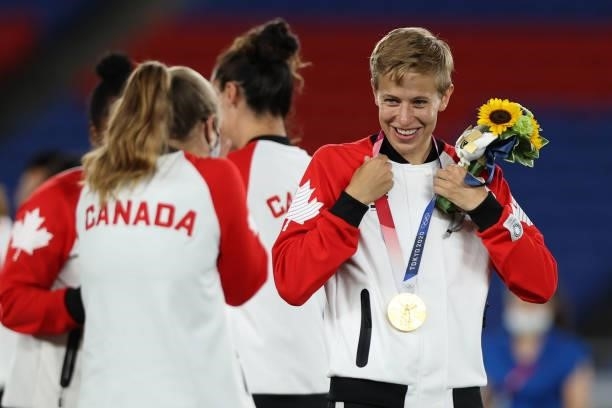 Gold medalist Quinn of Team Canada reacts with their gold medal after becoming the first openly transgender athlete to win Olympic gold during the...