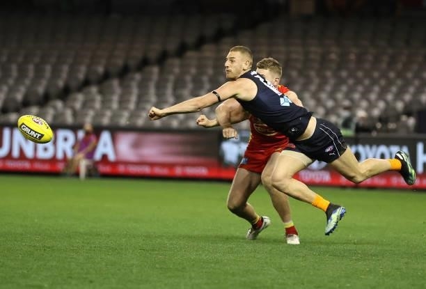 Liam Jones of the Blues punches the ball during the round 21 AFL match between Carlton Blues and Gold Coast Suns at Marvel Stadium on August 07, 2021...