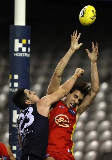 Ben King of the Suns is challenged by Jacob Weitering of the Blues during the round 21 AFL match between Carlton Blues and Gold Coast Suns at Marvel...