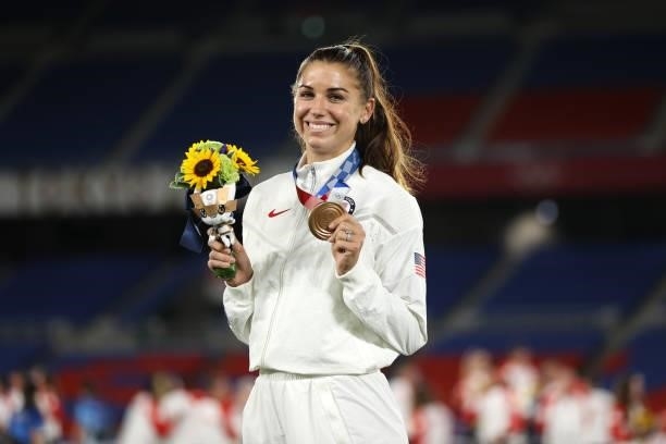 Alex Morgan of Team USA poses with her Bronze medal after the Gold Medal Match Women's Football match between Canada and Sweden at International...