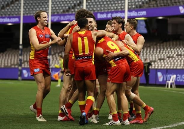 Wil Powell of the Suns celebrates after scoring a goal during the round 21 AFL match between Carlton Blues and Gold Coast Suns at Marvel Stadium on...