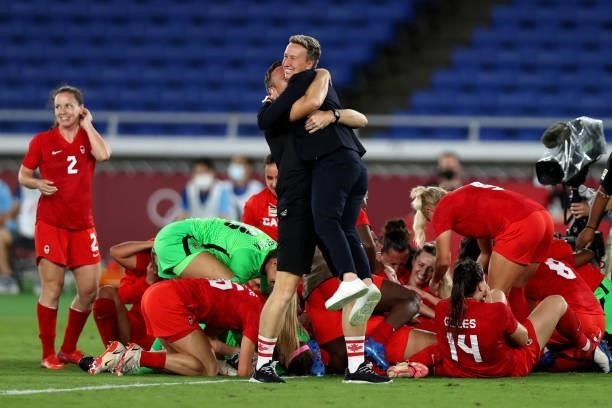 Head Coach of Team Canada Bev Priestman celebrates following her teams victory to win the gold medal during the Gold Medal Match Women's Football...