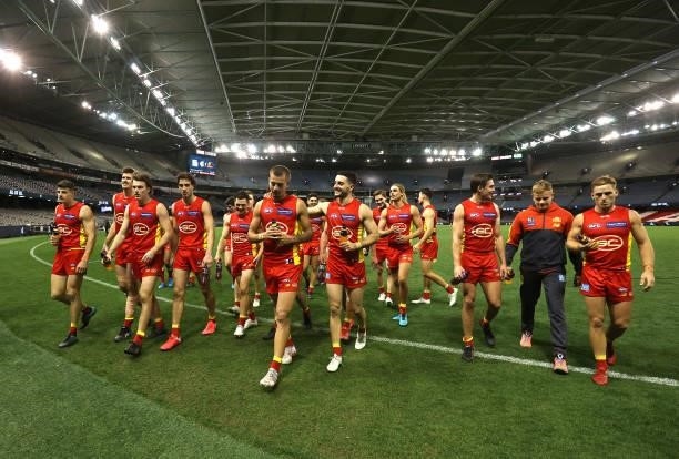 The Suns celebrate after they defeated the Blues during the round 21 AFL match between Carlton Blues and Gold Coast Suns at Marvel Stadium on August...