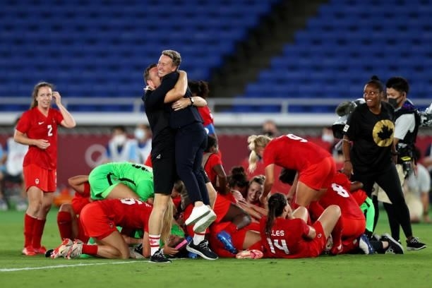 Head Coach of Team Canada Bev Priestman celebrates following her teams victory to win the gold medal during the Gold Medal Match Women's Football...