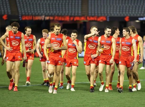 The Suns celebrate after they defeated the Blues during the round 21 AFL match between Carlton Blues and Gold Coast Suns at Marvel Stadium on August...