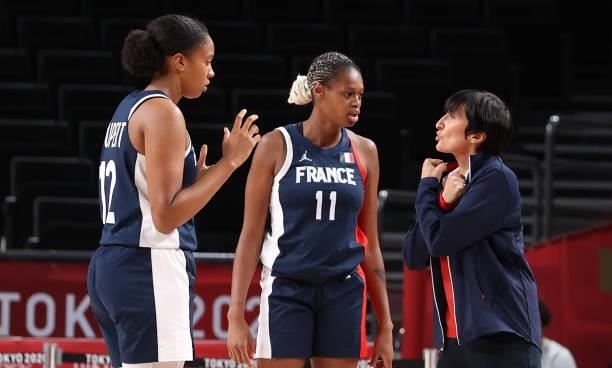 Team France Head Coach Valerie Garnier talks strategy with Iliana Rupert and Valeriane Vukosavljevic during the second half of a Women's Basketball...