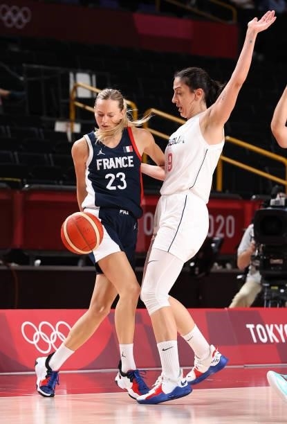 Marine Johannes of Team France drives to the basket against Jelena Brooks of Team Serbia during the second half of a Women's Basketball Bronze medal...