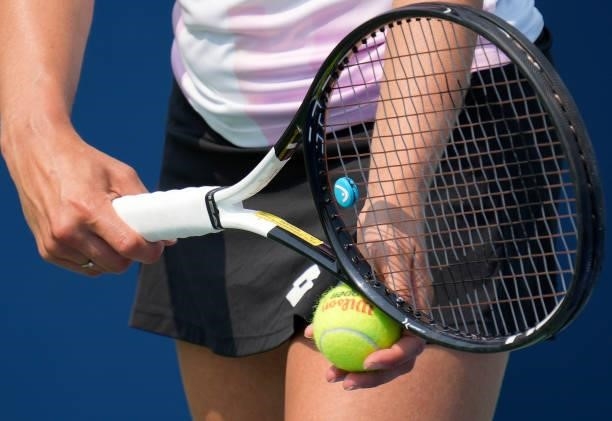 Detailed view of Elise Mertens of Belgium using a Head tennis racket serving a Wilson tennis ball to Yulia Putintseva of Kazakhstan during their...