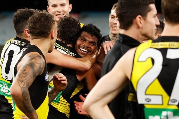 Maurice Rioli of the Tigers hugs Daniel Rioli of the Tigers after victory during the round 21 AFL match between Richmond Tigers and North Melbourne...