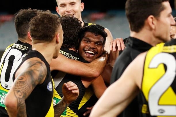 Maurice Rioli of the Tigers hugs Daniel Rioli of the Tigers after victory during the round 21 AFL match between Richmond Tigers and North Melbourne...