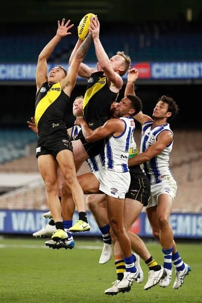 Jack Riewoldt of the Tigers and Shai Bolton of the Tigers fly for a mark during the round 21 AFL match between Richmond Tigers and North Melbourne...