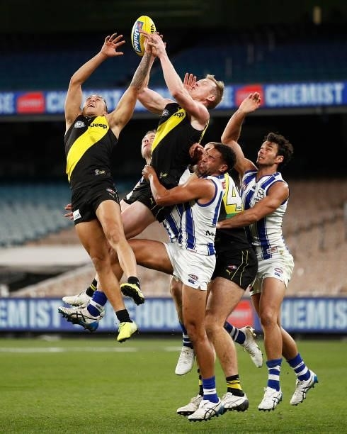 Jack Riewoldt of the Tigers and Shai Bolton of the Tigers fly for a mark during the round 21 AFL match between Richmond Tigers and North Melbourne...
