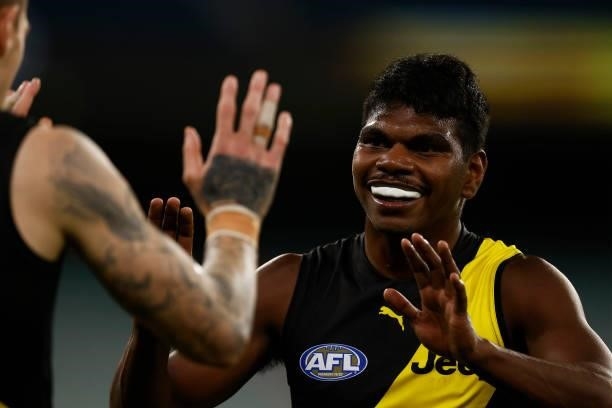 Maurice Rioli of the Tigers celebrates victory with Matthew Parker of the Tigers after the round 21 AFL match between Richmond Tigers and North...