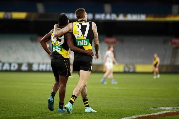 Maurice Rioli of the Tigers celebrates victory with Matthew Parker of the Tigers after the round 21 AFL match between Richmond Tigers and North...