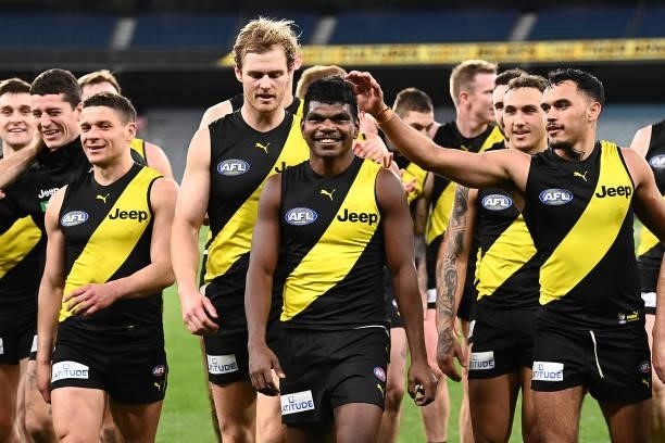 Maurice Rioli of the Tigers is congratulated by team mates after playing in his first game during the round 21 AFL match between Richmond Tigers and...