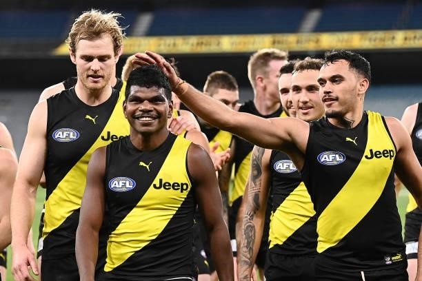 Maurice Rioli of the Tigers is congratulated by team mates after playing in his first game during the round 21 AFL match between Richmond Tigers and...