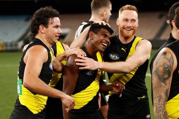 Maurice Rioli of the Tigers celebrates victory with Nick Vlastuin of the Tigers after the round 21 AFL match between Richmond Tigers and North...