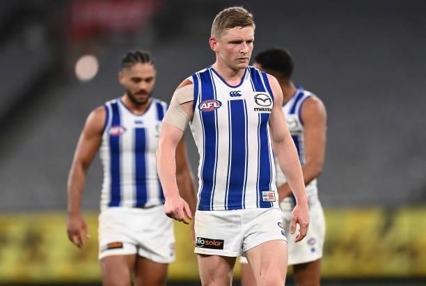 Jack Ziebell and his Kangaroos team mates look dejected after losing the round 21 AFL match between Richmond Tigers and North Melbourne Kangaroos at...