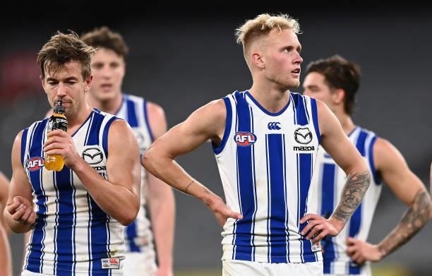 Jaidyn Stephenson and his Kangaroos team mates look dejected after losing the round 21 AFL match between Richmond Tigers and North Melbourne...