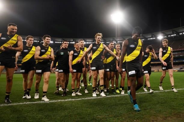 Maurice Rioli of the Tigers leads the Tigers off the field after winning the round 21 AFL match between Richmond Tigers and North Melbourne Kangaroos...