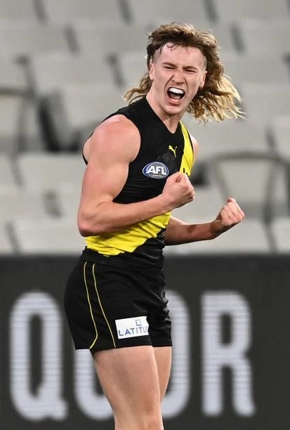 Hugo Ralphsmith of the Tigers celebrates kicking a goal during the round 21 AFL match between Richmond Tigers and North Melbourne Kangaroos at...