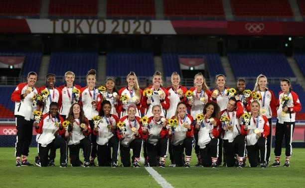 Team Canada celebrate winning the gold medal during the medal ceremony during the Gold Medal Match Women's Football match between Canada and Sweden...