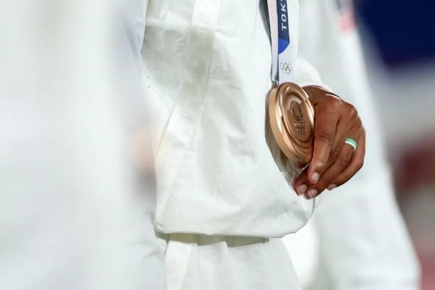 Detailed view of an Athlete from Team USA holding her Bronze medal following the Gold Medal Match Women's Football match between Canada and Sweden at...