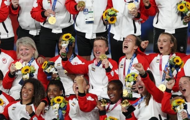 Head Coach of Team Canada Bev Priestman celebrates with her team following her teams victory to win the gold medal during the Gold Medal Match...