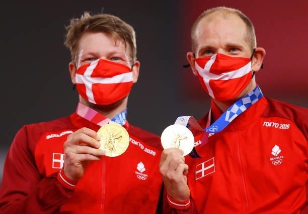 Gold medalists Lasse Norman Hansen and Michael Morkov of Denmark, pose on the podium during the medal ceremony after the Men's Madison final of the...