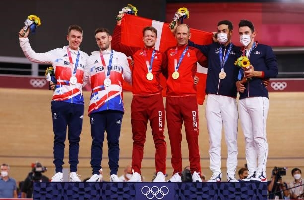 Silver medalists Ethan Hayter and Matthew Walls of Team Great Britain, gold medalists Lasse Norman Hansen and Michael Morkov of Denmark, and bronze...