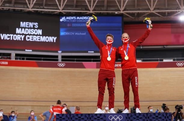 Gold medalists Lasse Norman Hansen and Michael Morkov of Denmark, pose on the podium during the medal ceremony after the Men's Madison final of the...