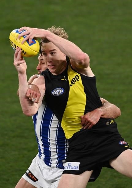 Tom J. Lynch of the Tigers marks infront of Robbie Tarrant of the Kangaroos during the round 21 AFL match between Richmond Tigers and North Melbourne...