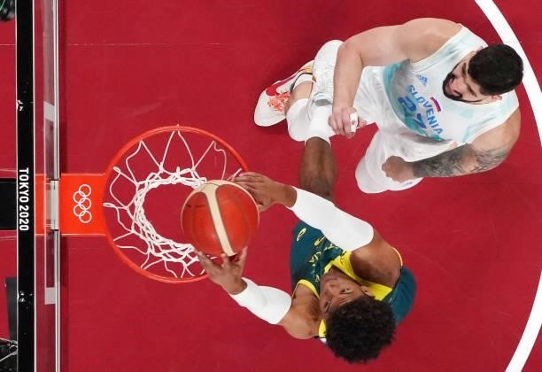 Matisse Thybulle of Team Australia dunks against Ziga Dimec of Team Slovenia during the first half of the Men's Basketball Bronze medal game on day...