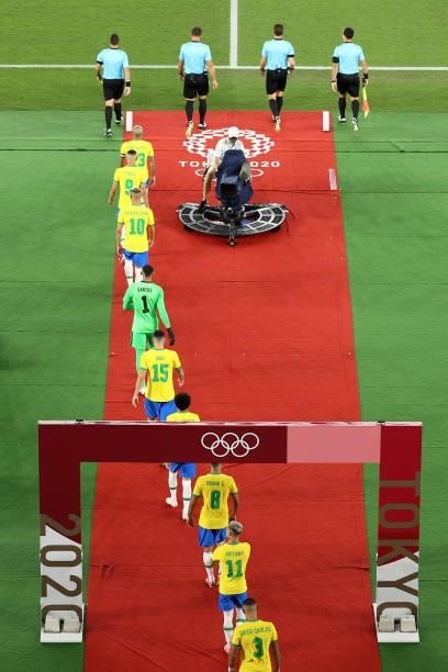 Dani Alves of Team Brazil leads his side out prior to the Men's Gold Medal Match between Brazil and Spain on day fifteen of the Tokyo 2020 Olympic...