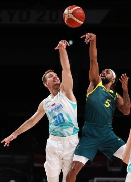Patty Mills of Team Australia shoots against Zoran Dragic of Team Slovenia during the first half of the Men's Basketball Bronze medal game on day...