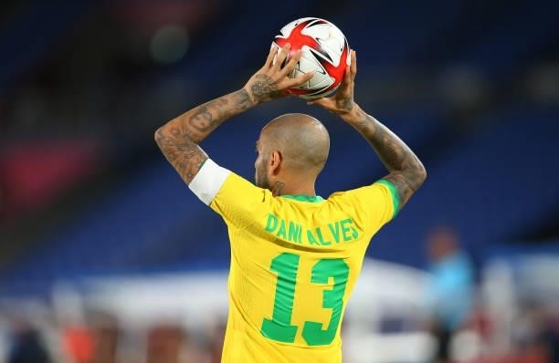 Dani Alves of Team Brazil prepares to take a throw in during the Men's Gold Medal Match between Brazil and Spain on day fifteen of the Tokyo 2020...