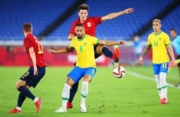 Matheus Cunha of Team Brazil is challenged by Pau Torres of Team Spain during the Men's Gold Medal Match between Brazil and Spain on day fifteen of...