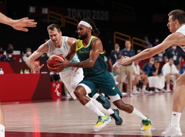 Patty Mills of Team Australia drives to the basket against Team Slovenia during the first half of the Men's Basketball Bronze medal game on day...