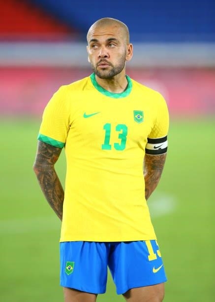 Dani Alves of Team Brazil looks on as he stands for the national anthem prior to the Men's Gold Medal Match between Brazil and Spain on day fifteen...