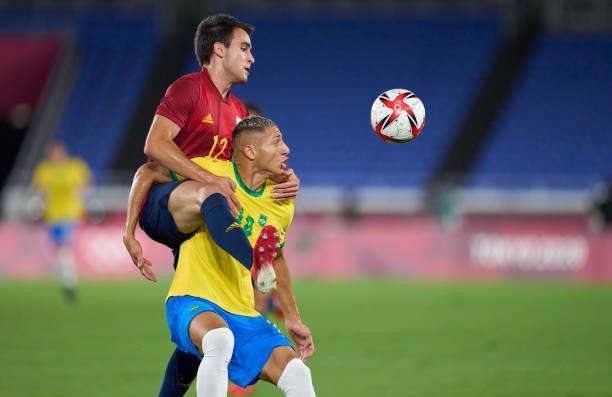 Richarlison De Andrade of Brazil competes for the ball with Eric Garcia of Spain during the Men's Gold Medal Match between Brazil and Spain on day...
