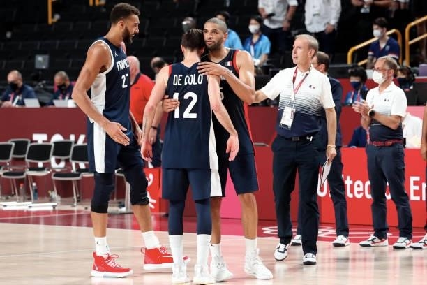 Captain of Team France Nicolas Batum hugs Nando de Colo after a defeat in the Men's Basketball Finals game between Team United States and Team France...