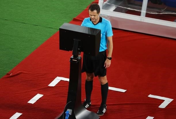 Match Referee, Chris Beath checks the VAR screen before awarding Team Brazil a penalty during the Men's Gold Medal Match between Brazil and Spain on...