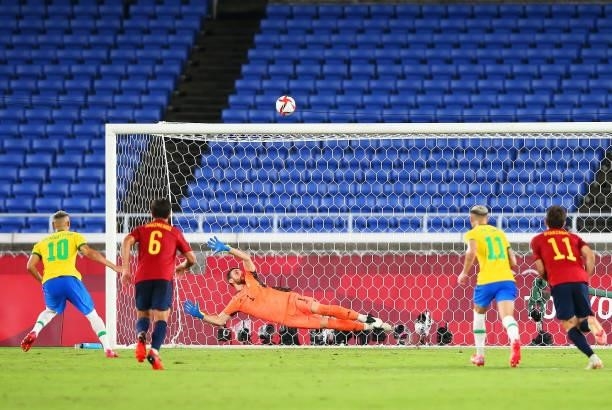 Richarlison of Team Brazil takes a penalty kick and misses as Unai Simon of Team Spain looks on during the Men's Gold Medal Match between Brazil and...