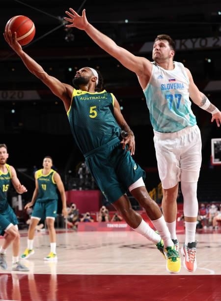 Patty Mills of Team Australia drives to the basket against Luka Doncic of Team Slovenia during the second half of the Men's Basketball Bronze medal...